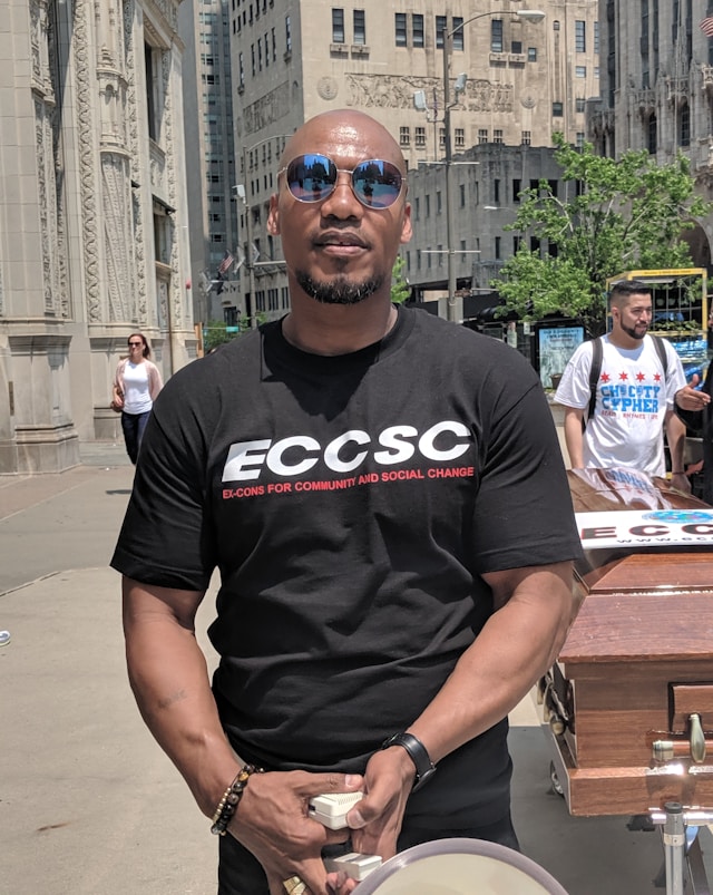 Man standing on a street looking at the camera